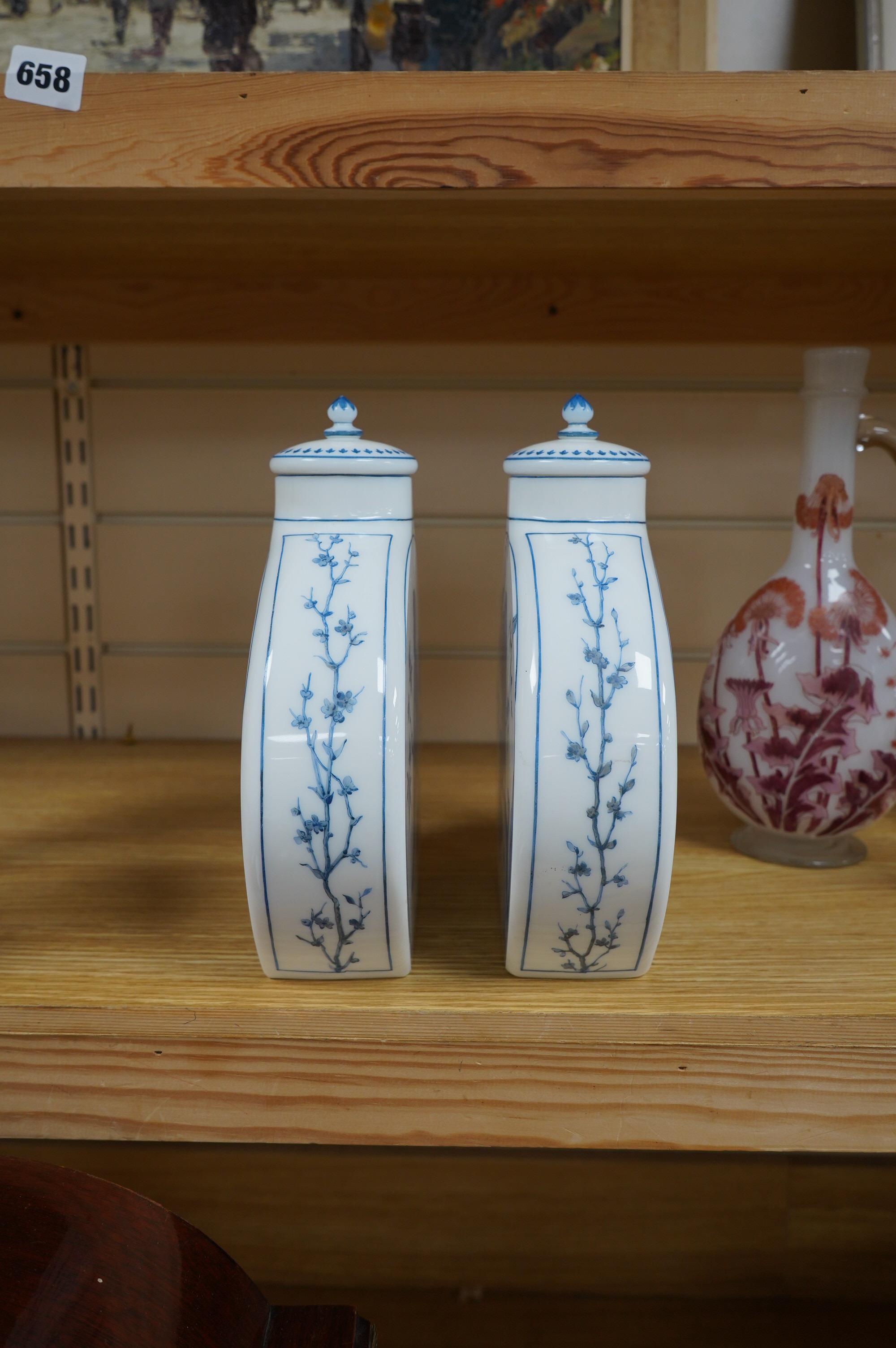 A pair of Victorian Aesthetic period enamelled opaque white glass moonflask vases decorated with children after W.S.Coleman, 23cm. Condition - one small chip found to inner rim of one cover, otherwise good.